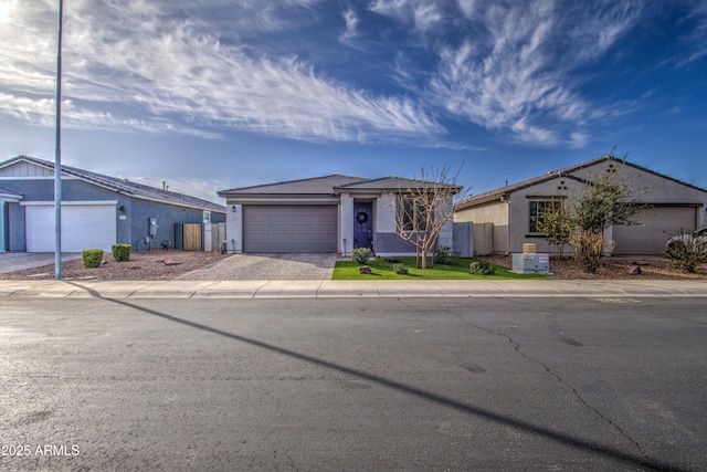 ranch-style house featuring a garage