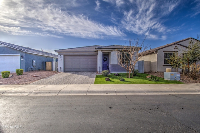 ranch-style home featuring a garage