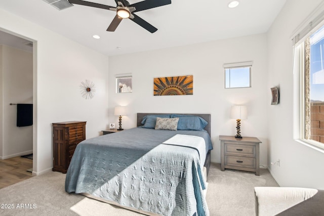 carpeted bedroom with ceiling fan