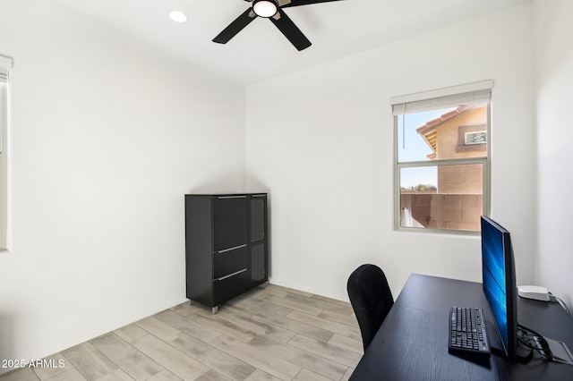 office space with ceiling fan and light hardwood / wood-style flooring