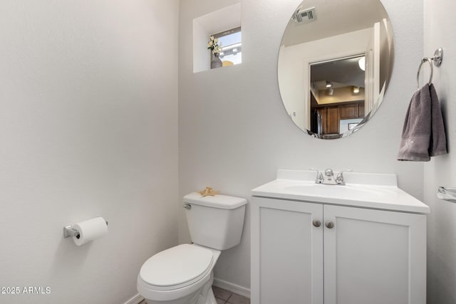 bathroom with toilet and vanity