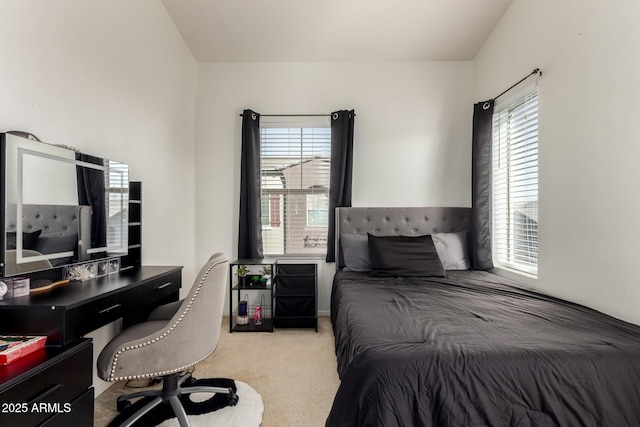 carpeted bedroom featuring multiple windows