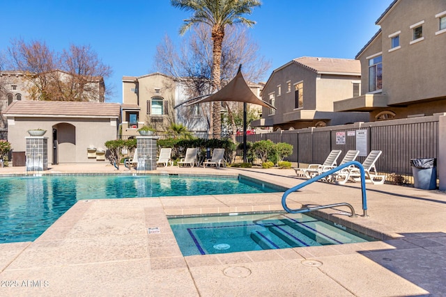 view of pool featuring a community hot tub and a patio