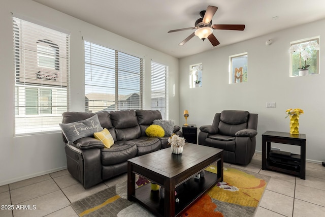 living room with ceiling fan and light tile patterned flooring