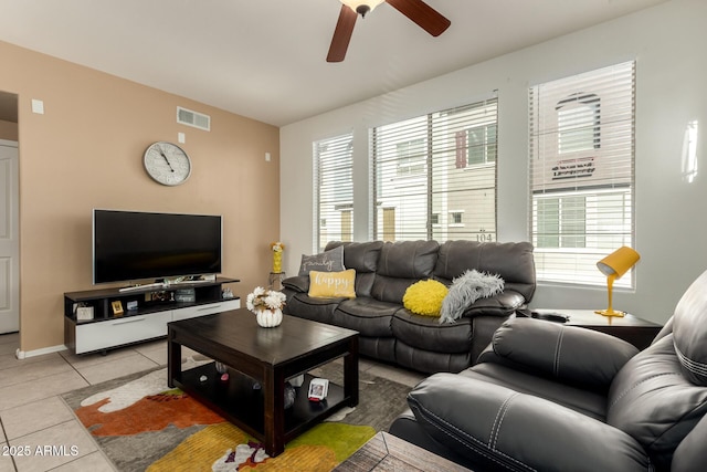 living room featuring ceiling fan and light tile patterned floors