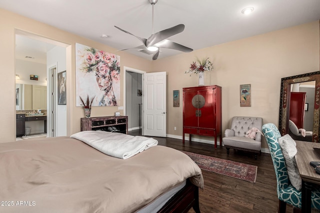 bedroom featuring a ceiling fan, visible vents, wood finished floors, baseboards, and ensuite bathroom
