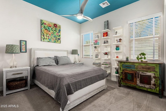 bedroom with visible vents, carpet, and ceiling fan
