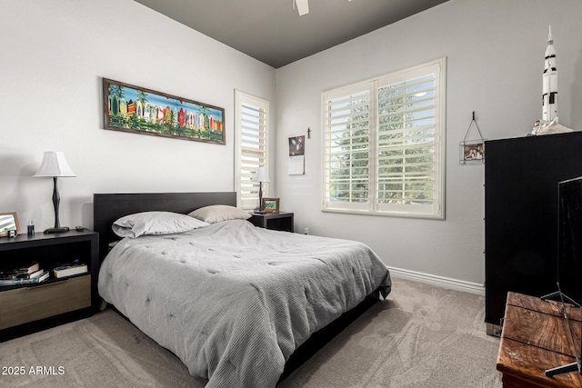 bedroom featuring baseboards and carpet