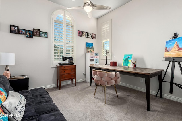 office space featuring baseboards, carpet floors, and a ceiling fan