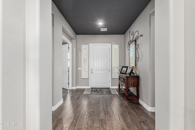 foyer entrance featuring dark wood-style floors, visible vents, recessed lighting, and baseboards