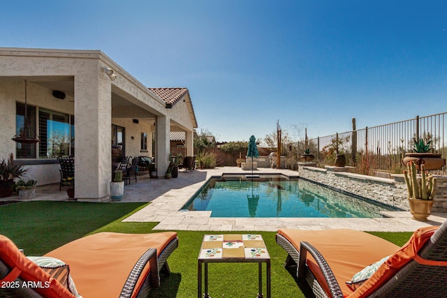 view of pool featuring a fenced in pool, a patio, a lawn, and a fenced backyard