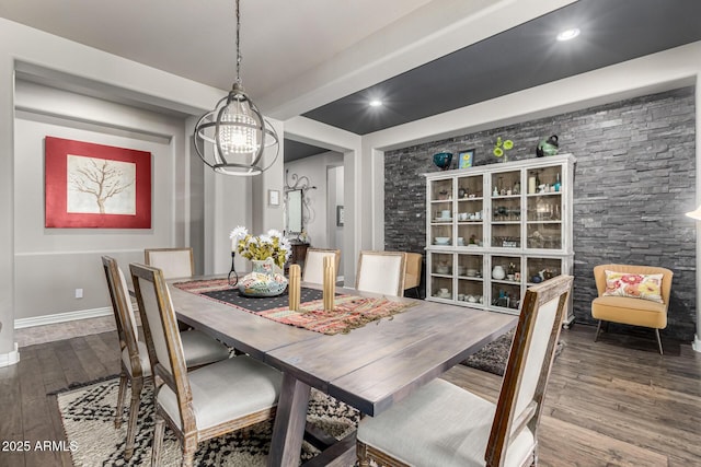 dining area featuring recessed lighting, an inviting chandelier, baseboards, and wood finished floors