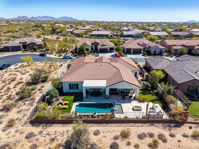 drone / aerial view with a residential view and a mountain view