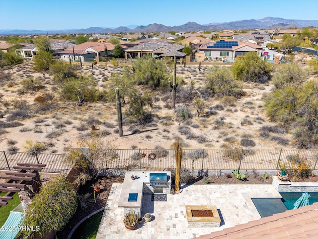 aerial view featuring a mountain view and a residential view