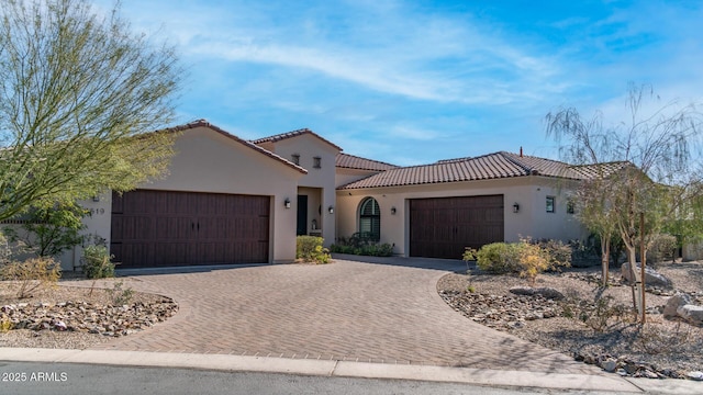 mediterranean / spanish-style house featuring a garage