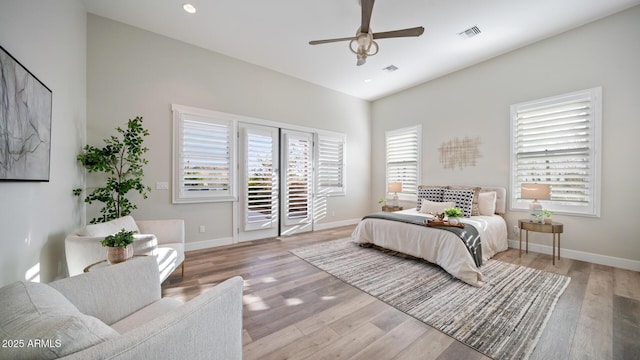 bedroom with ceiling fan, access to exterior, and light wood-type flooring