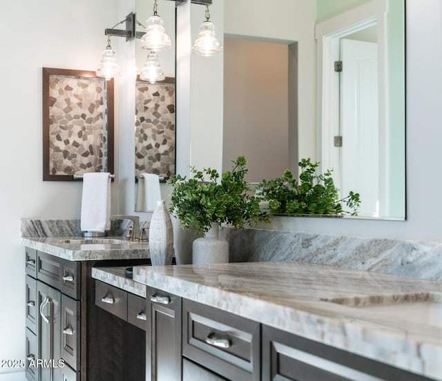 interior space with sink and decorative light fixtures