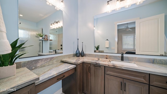 bathroom featuring vanity, a shower, and ceiling fan