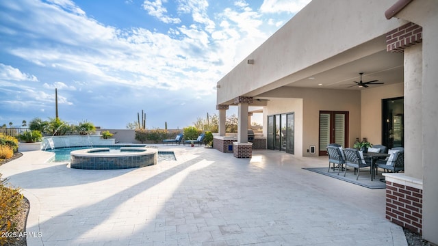 view of patio with pool water feature, ceiling fan, and a pool with hot tub