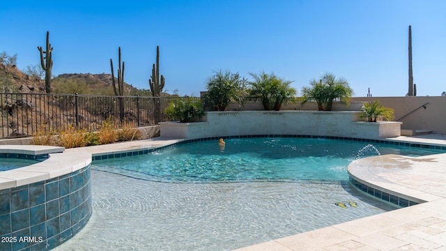 view of pool featuring pool water feature