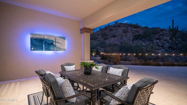 view of patio terrace at dusk