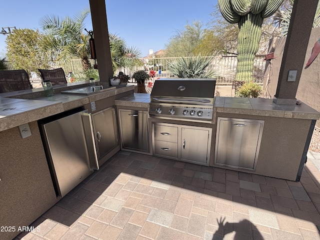 view of patio / terrace with fence, grilling area, and area for grilling