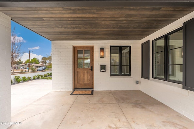 entrance to property featuring a patio area