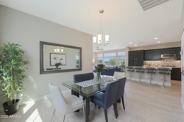20702 W Hillcrest Blvd, Buckeye, AZ 85396 - dining room featuring a chandelier and recessed lighting