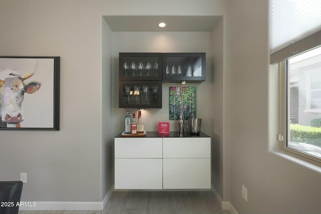 20702 W Hillcrest Blvd, Buckeye, AZ 85396 - indoor dry bar with healthy amount of natural light, recessed lighting, and wood finished floors