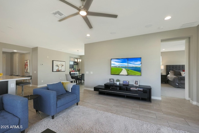 20702 W Hillcrest Blvd, Buckeye, AZ 85396 - living room featuring a chandelier, ceiling fan, and recessed lighting