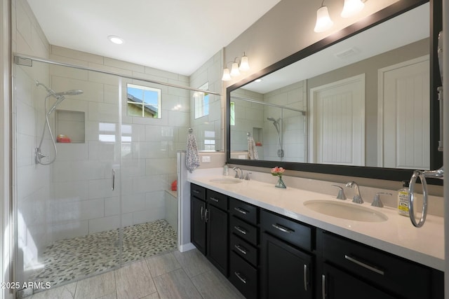 20702 W Hillcrest Blvd, Buckeye, AZ 85396 - bathroom featuring double vanity and a stall shower