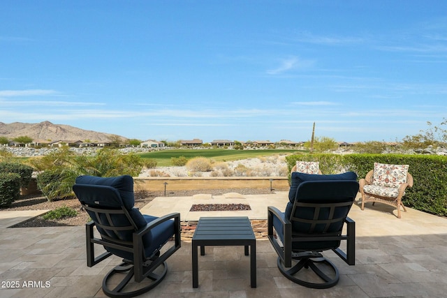 20702 W Hillcrest Blvd, Buckeye, AZ 85396 - view of patio / terrace featuring a fire pit and a mountain view