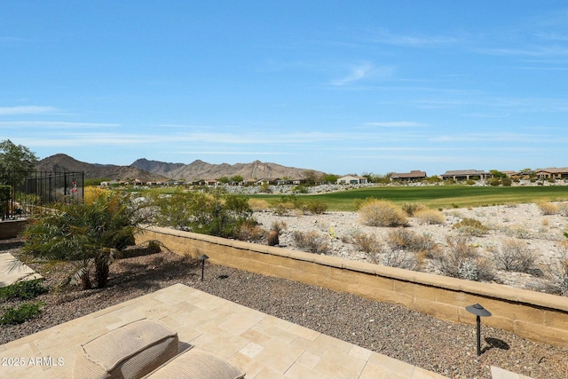 20702 W Hillcrest Blvd, Buckeye, AZ 85396 - view of patio / terrace with a mountain view