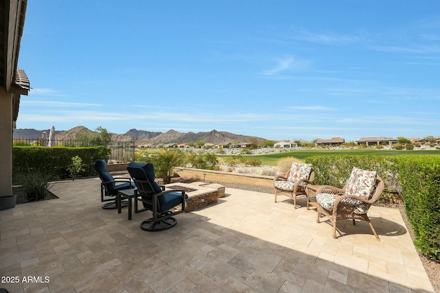 20702 W Hillcrest Blvd, Buckeye, AZ 85396 - view of patio with a mountain view and a fire pit