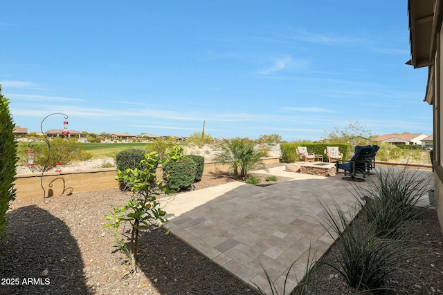 20702 W Hillcrest Blvd, Buckeye, AZ 85396 - view of patio / terrace featuring an outdoor fire pit