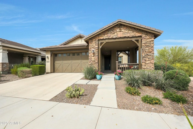 20702 W Hillcrest Blvd, Buckeye, AZ 85396 - view of front of house with stone siding, a garage, concrete driveway, stucco siding, and a porch