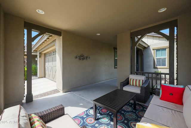 20702 W Hillcrest Blvd, Buckeye, AZ 85396 - view of patio featuring outdoor lounge area and a garage