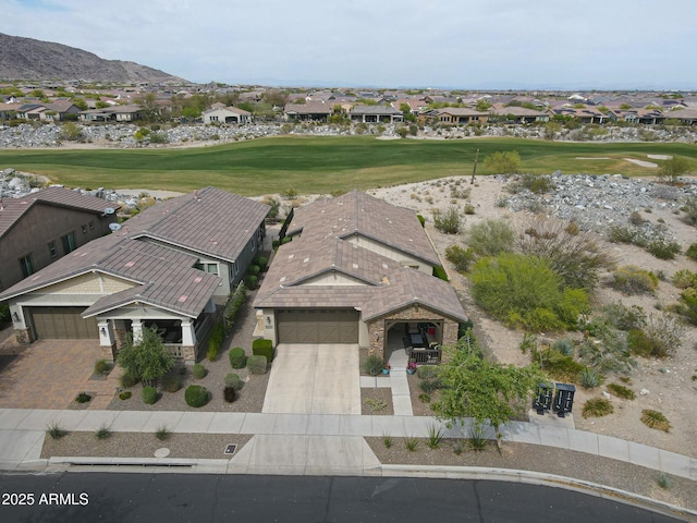 20702 W Hillcrest Blvd, Buckeye, AZ 85396 - aerial perspective of suburban area with a golf course and a mountain backdrop