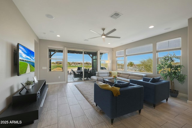 20702 W Hillcrest Blvd, Buckeye, AZ 85396 - living area with ceiling fan, recessed lighting, and wood finish floors