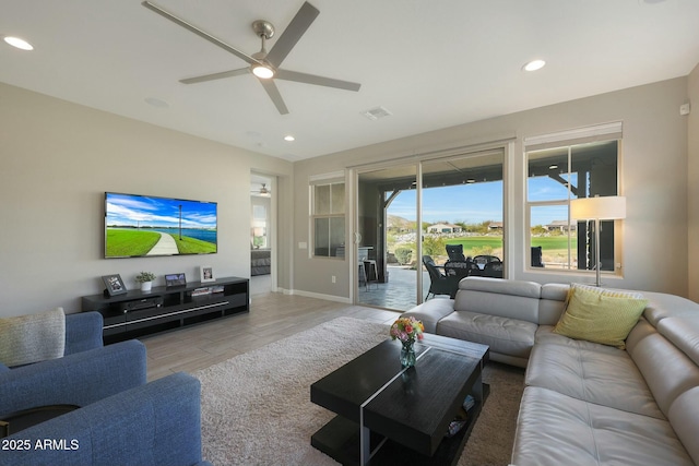 20702 W Hillcrest Blvd, Buckeye, AZ 85396 - living room with ceiling fan and recessed lighting
