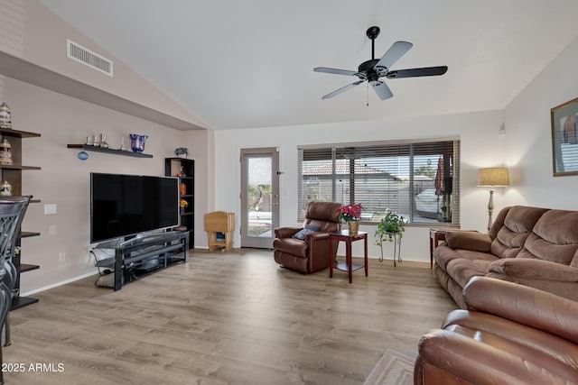 living room with vaulted ceiling, ceiling fan, and light hardwood / wood-style floors