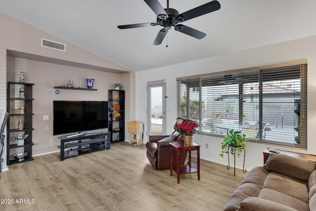 living room with lofted ceiling, light hardwood / wood-style floors, and ceiling fan