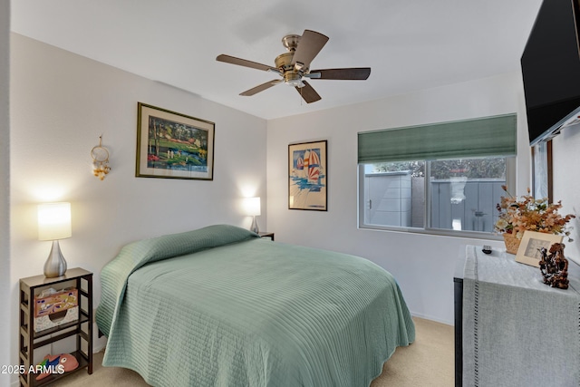 bedroom featuring light colored carpet and ceiling fan