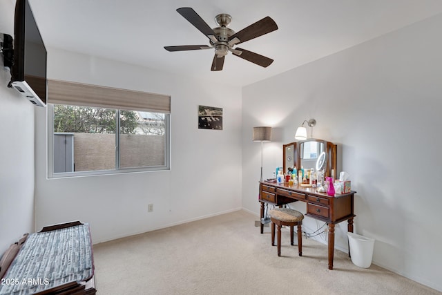 office area with ceiling fan and light carpet