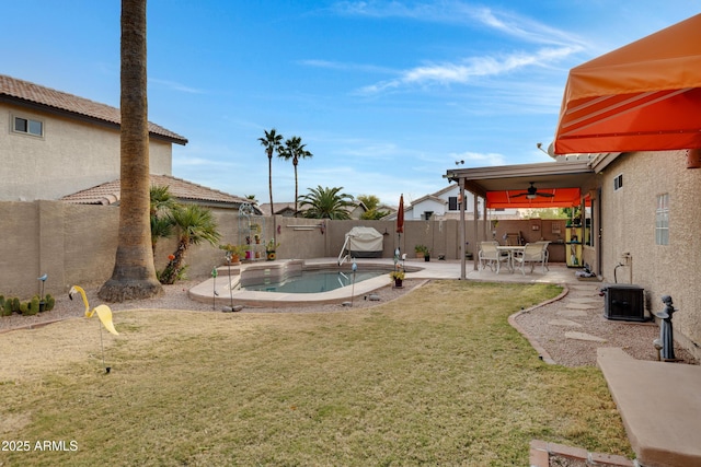 view of yard with a fenced in pool, a patio, central AC unit, and ceiling fan