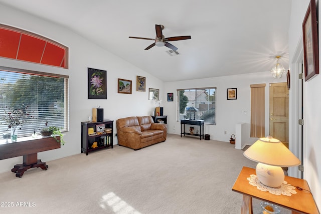 carpeted living room with vaulted ceiling and ceiling fan