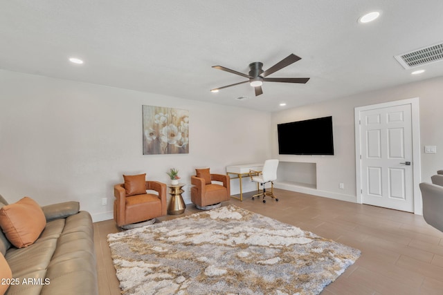 living room with ceiling fan