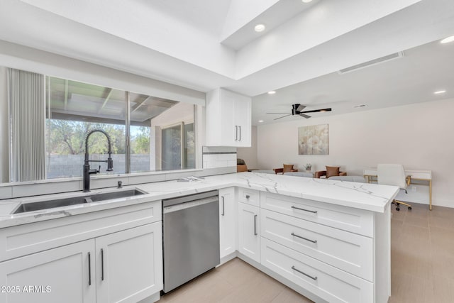 kitchen with white cabinetry, sink, ceiling fan, stainless steel dishwasher, and kitchen peninsula