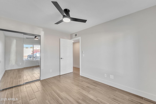 unfurnished bedroom with a closet and ceiling fan