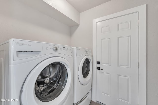 laundry area with separate washer and dryer